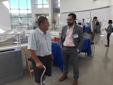 Northern California Regional Director Boris Lipkin speaks to a stakeholder at an outreach event