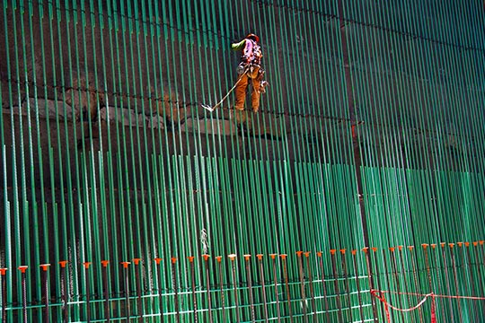 Construction worker in a harness
