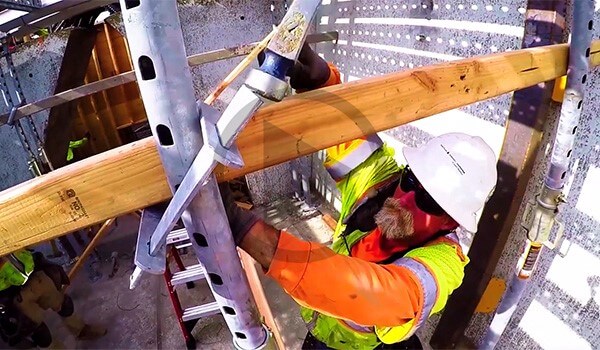 Construction worker building falsework