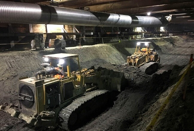 Excavators working on Purple Line Extension underground