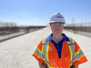 Woman posing on construction site.