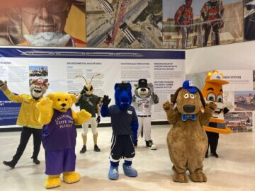 Mascots from Cal Fire, the California State Fair, Sacramento State, UC Davis, the River Cats, CalTrans, and Sacramento Metropolitan Air Quality Management District visiting the high-speed rail exhibit.