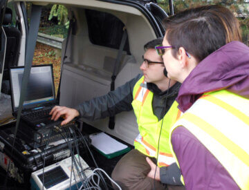 Acoustical engineers from Wilson Ihrig analyze data in the field. Researchers study how much noise and vibration will be emitted by high-speed rail trains and work to mitigate impact.