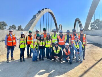 Students pose for a photo atop of a high-speed rail viaduct structure. 