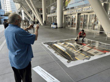 Max Rafie takes a photo of the #ThePortalSFtoHSR 3D public art shortly after it’s installment.