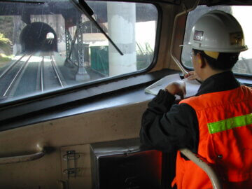 Phil Leong in the cab of a Caltrain train.