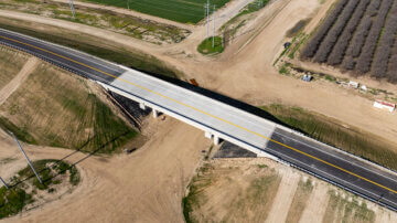 Fargo Ave Overcrossing spans the right of way below, which disappears out of frame.