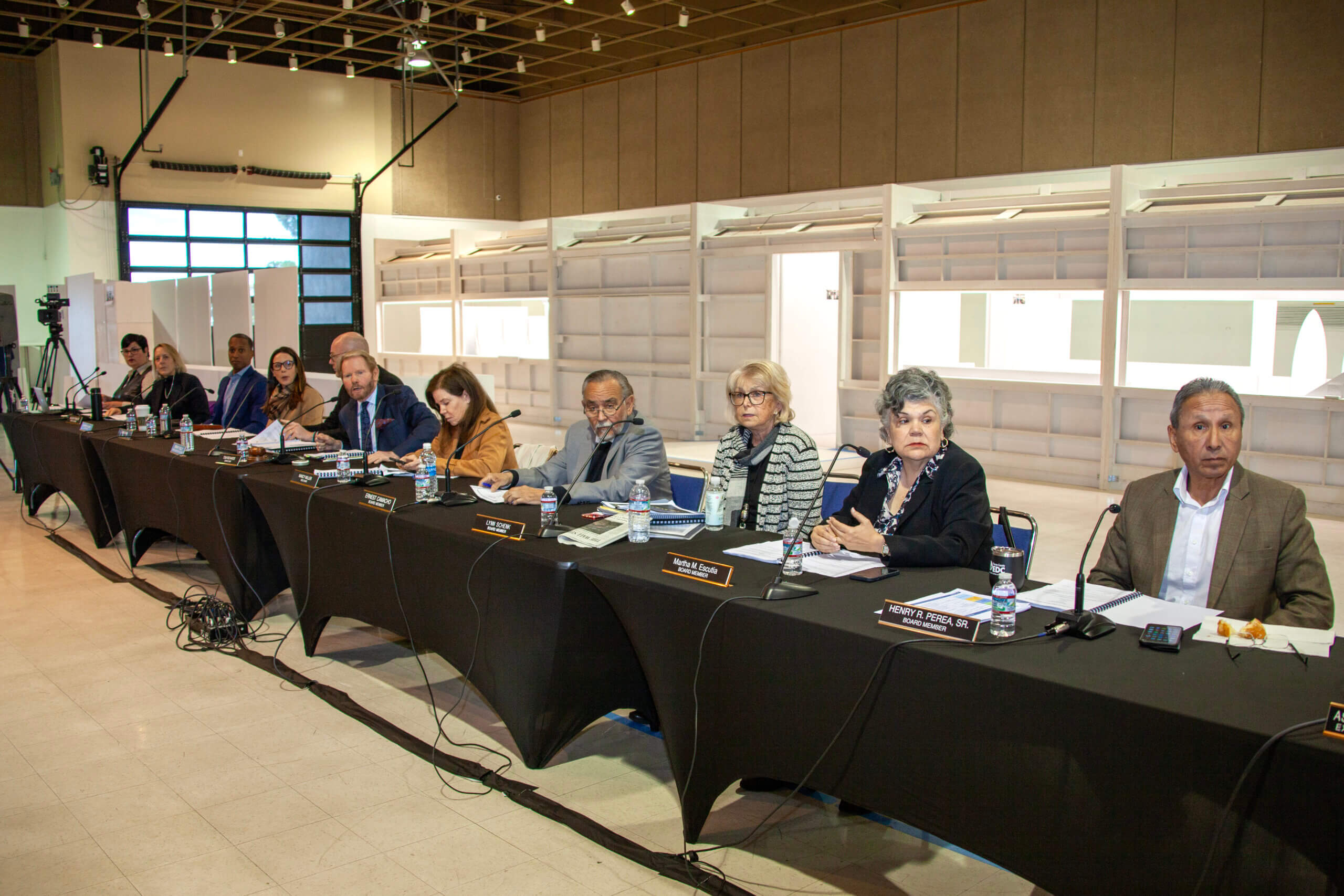 California High-Speed Rail Board of Directors sitting in front of trainset interior white mock-ups.